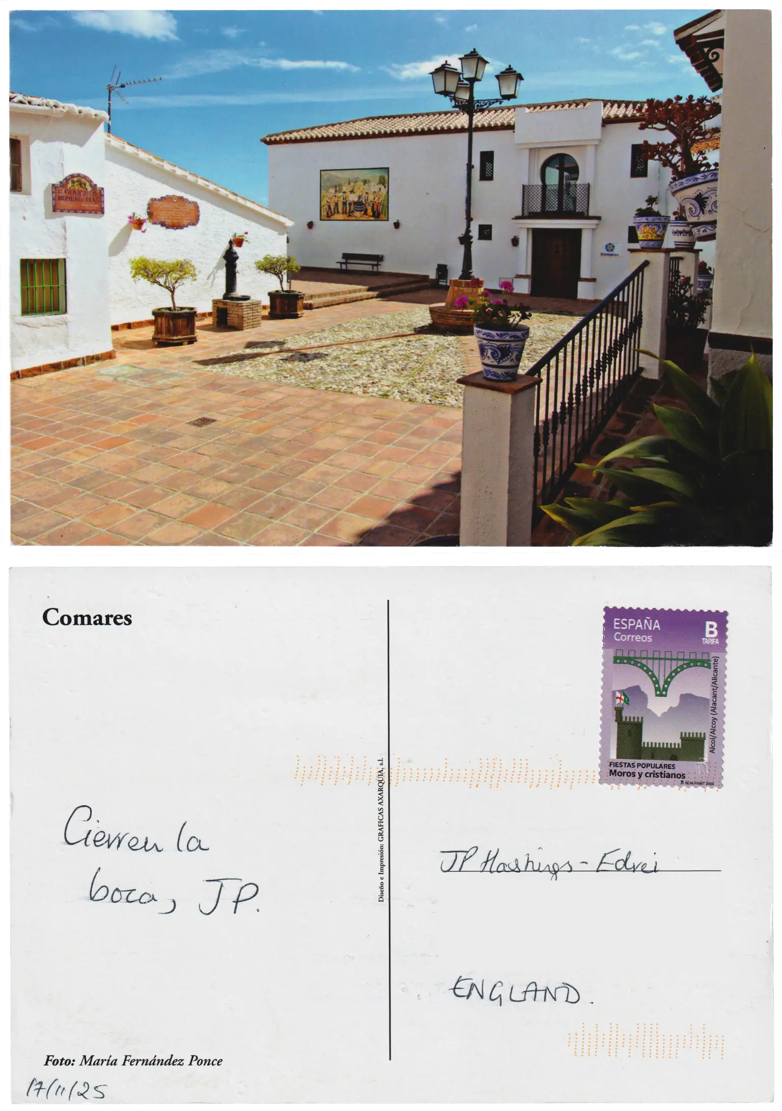Both sides of a postcard. On the front: A small & cute terracotta tiled plaza, with white-walled low buildings around it, on a sunny day. Pretty blue and white painted terracotta pots holding succulents are on some fence posts, and there's a mural of a jolly band on the wall in the distance. On the back: Cierren la boca, JP.