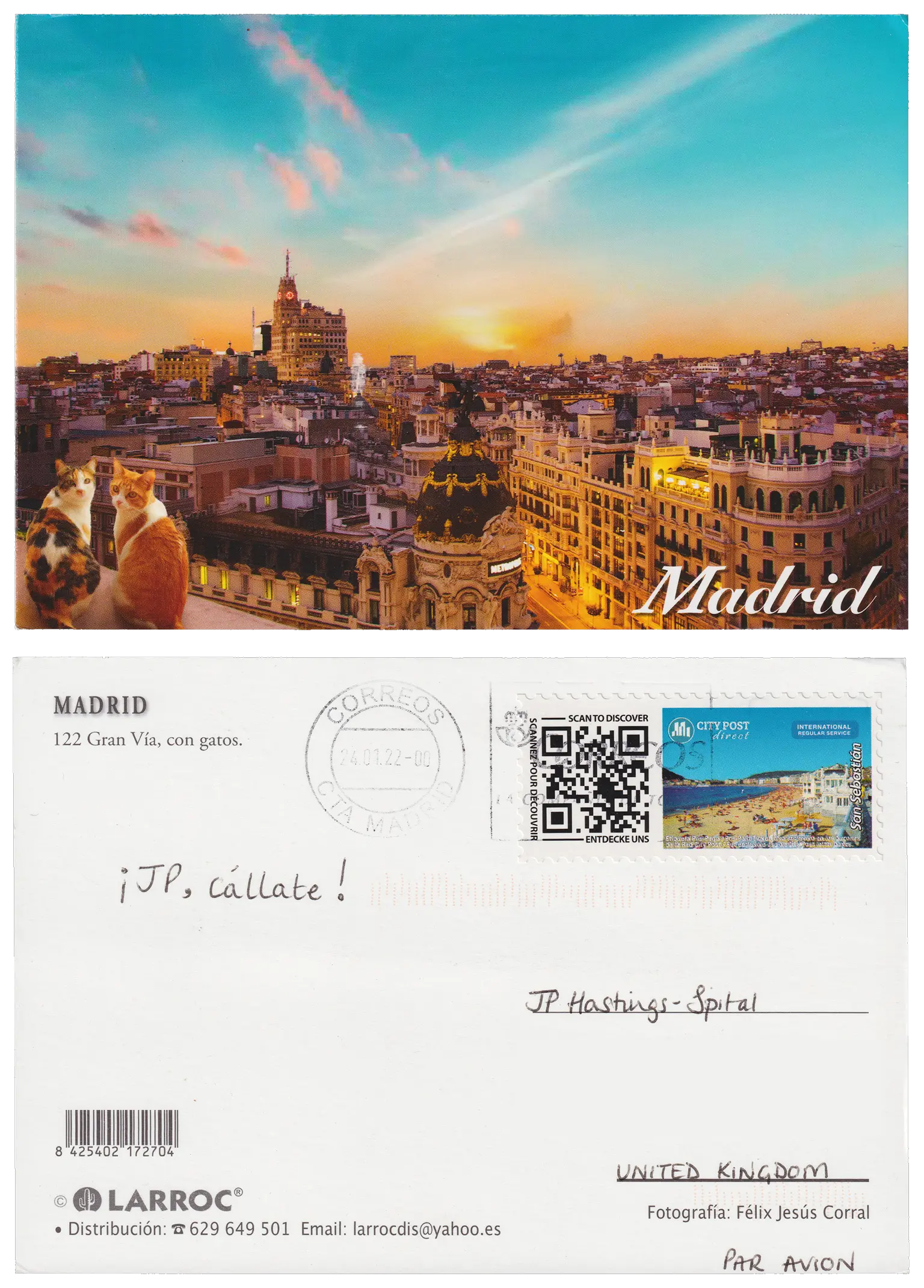 Both sides of a postcard. On the front: A photograph across the rooves of Madrid, with two cats sitting on the rooftop edge. On the back: ¡JP, cállate!